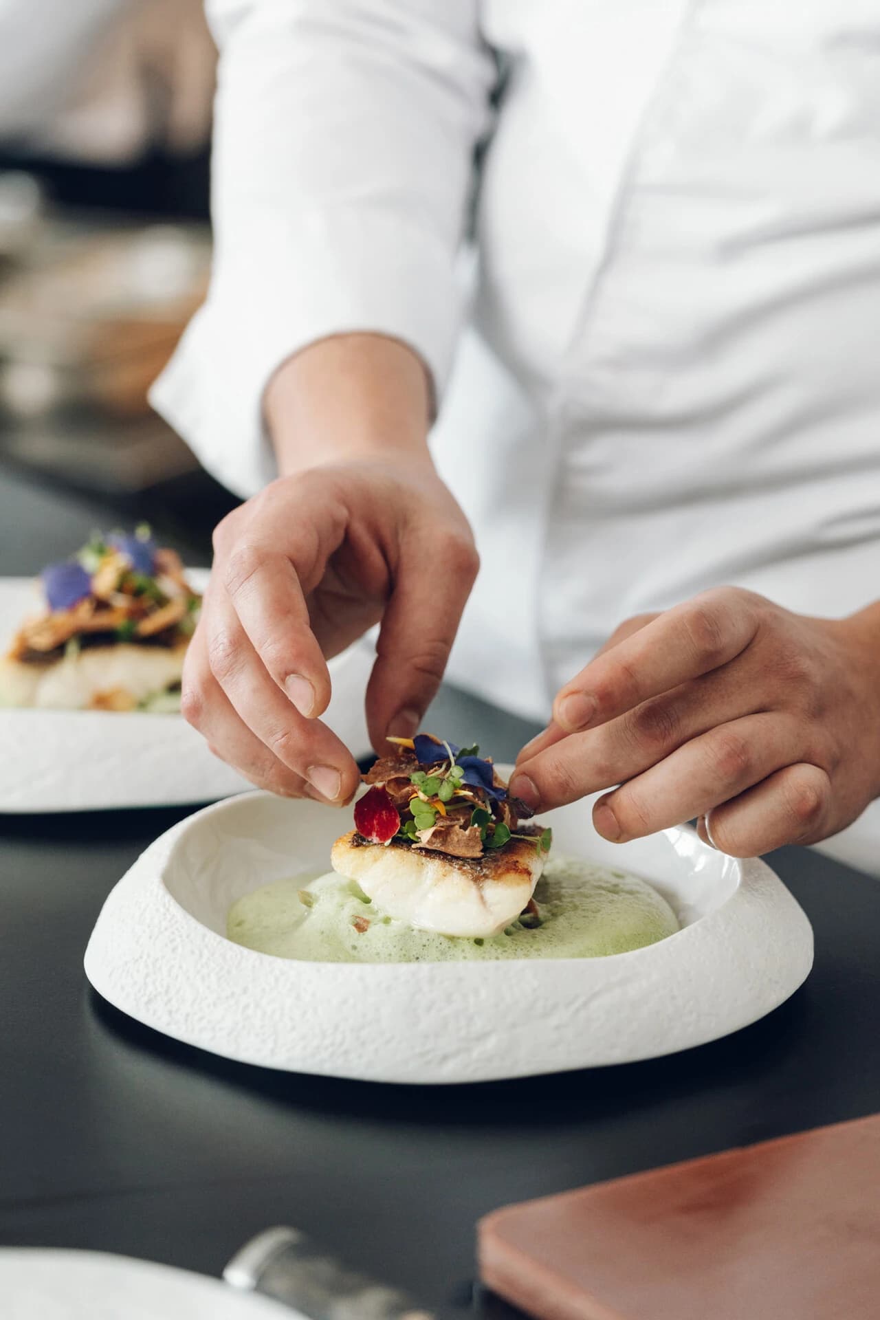 Chef plating a dish